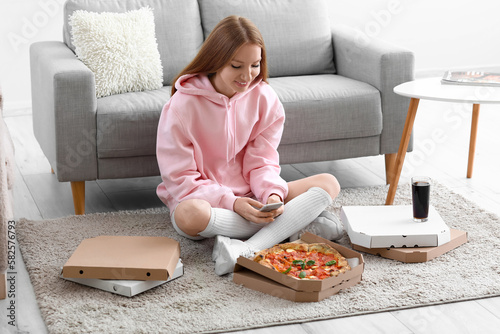Young woman with tasty pizz...