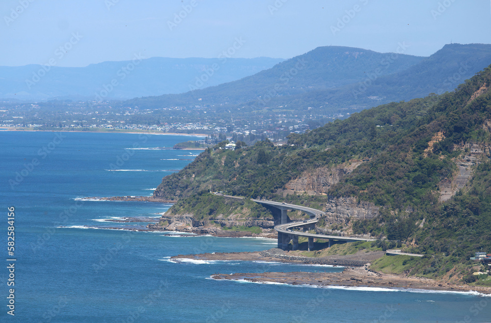 A view looking out to Sea Cliff Bridge which extends along the Grand Pacific Drive a 140 kilometre coastal drive