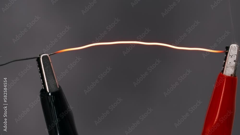 Nichrome wire heated to red under high current strength. Nichrome