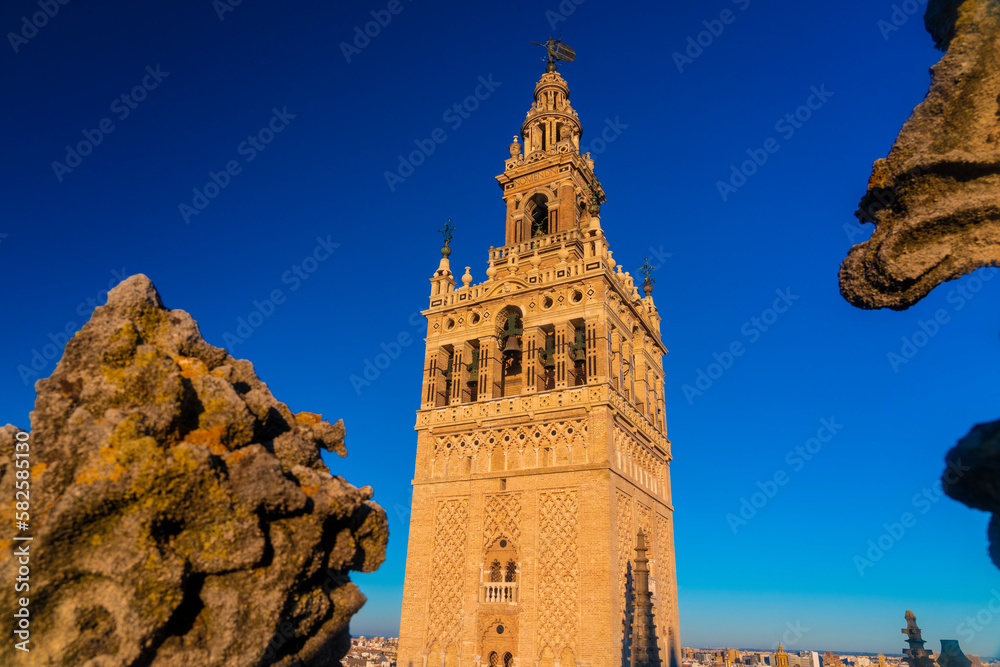 View of La giralda the bell tower of the cathedral of Seville from the rooftop of the cathedral, It was originally built as the minaret for the Great Mosque of Seville in al-Andalus, Moorish Spain