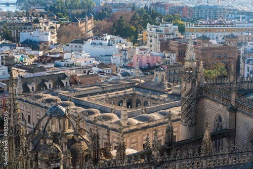 Details of the Cathedral and the chapel of Seville from the rooftop of the church with the historic cityscape in the background