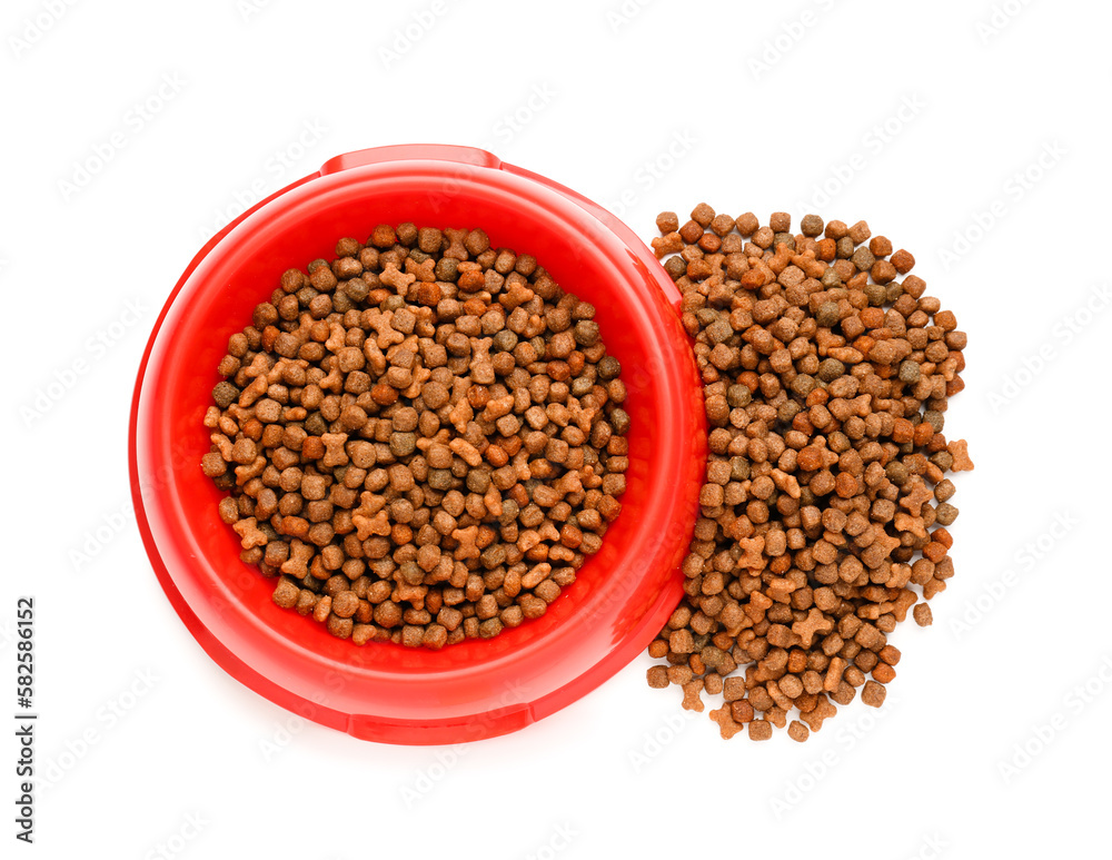 Red bowl of dry pet food on white background, closeup Red bowl of dry pet food on white background, closeup