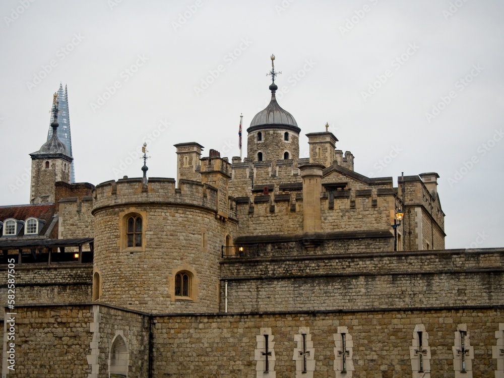 Modern skyscrapers rise above the centuries-old Tower of London, home to the Crown Jewels