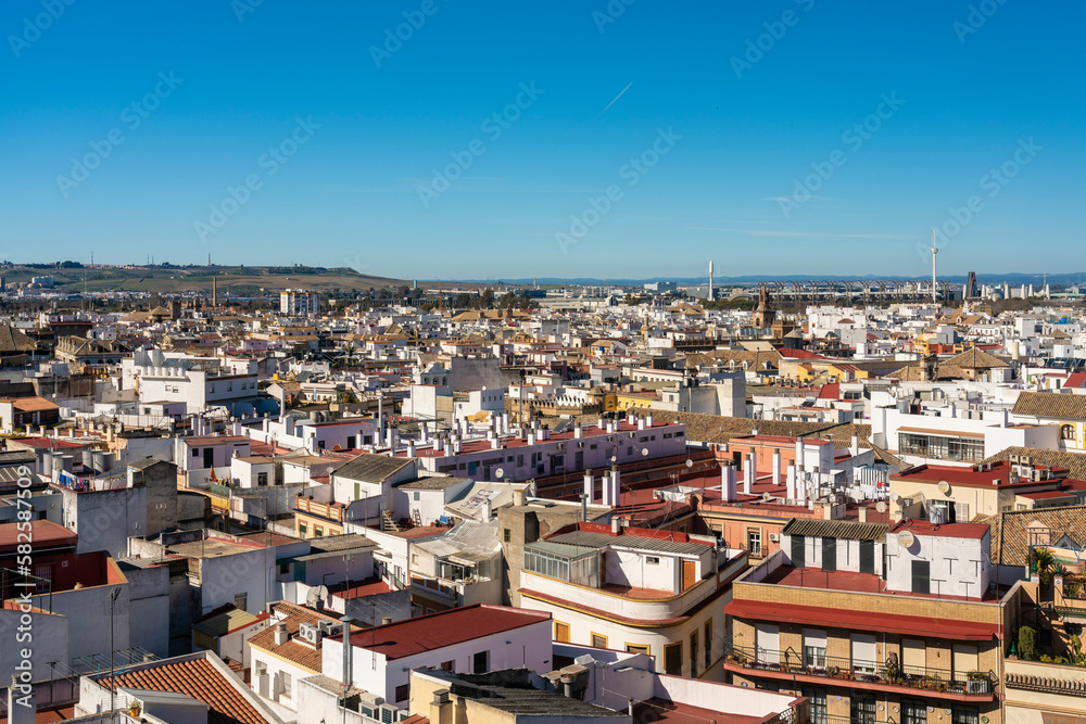 View of the historic white buildings of Seville from Setas de Seville or Metropol Parasol