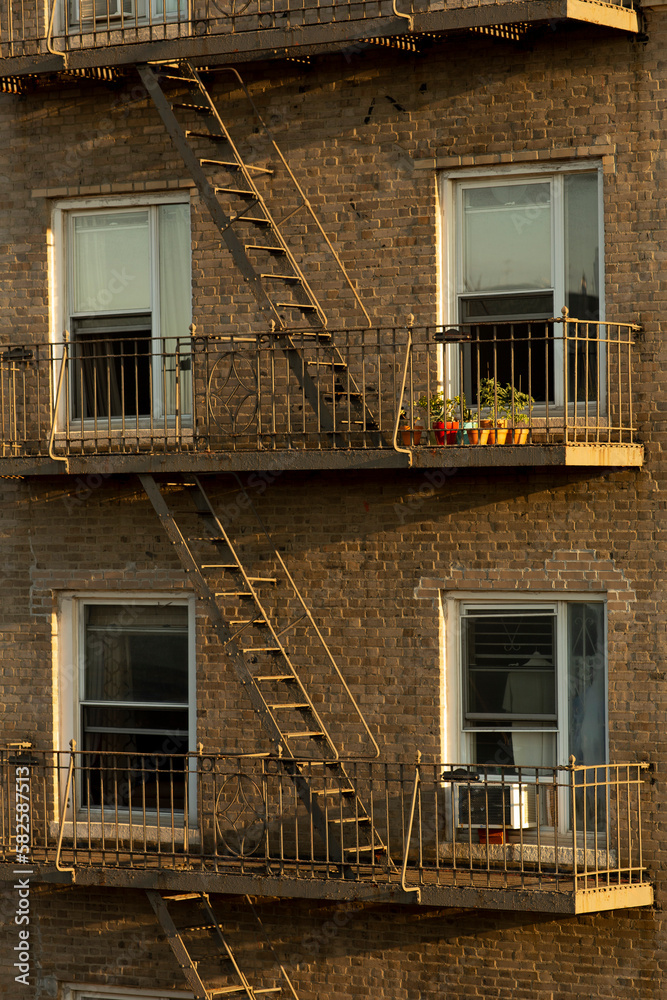 Fire escape and windows of city apartment building Fire escape and windows of city apartment building
