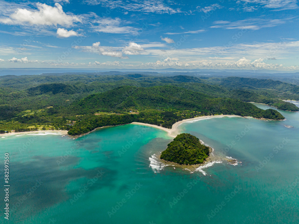 Aerial view of tropical beach with crystal clear water in the tropics. Sabah, Borneo, Malaysia.