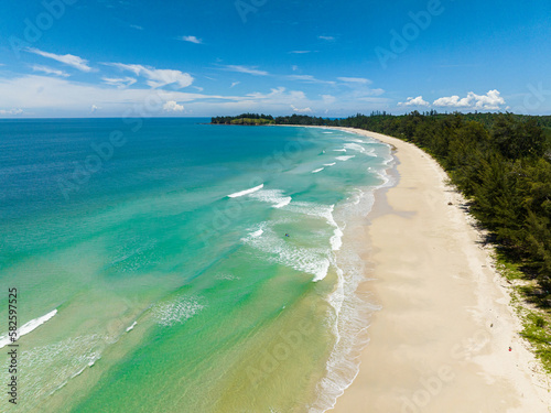 Aerial view of sandy beach and turquoise water in the tropics. Kalampunian beach. Sabah, Borneo, Malaysia.