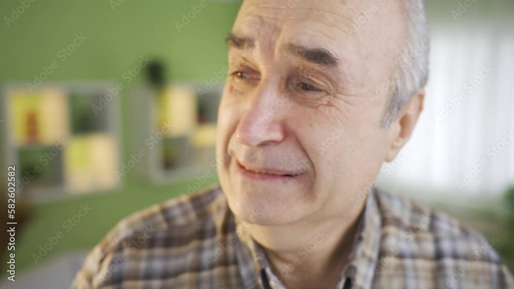 Depressed lonely old man crying.
Unhappy and depressed old man crying from loneliness and grief.
