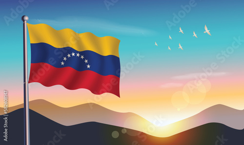 Venezuela flag with mountains and morning sun in background