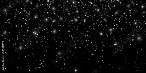 Flying dust particles on a black background. Black white bokeh. Bokeh lights on a black background. Snow fall background
