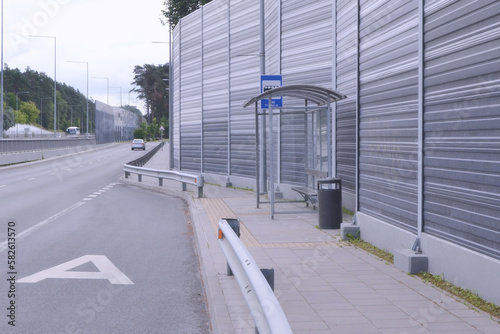 Bus stop near the sound-absorbing tunnel. Modern technology in the city.