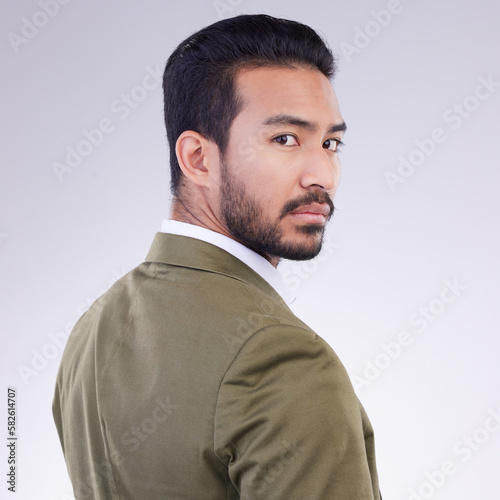 Portrait, business and Asian man with confidence, success and concentration against a studio background. Face, Japanese male employee and consultant with growth, leadership skills and management