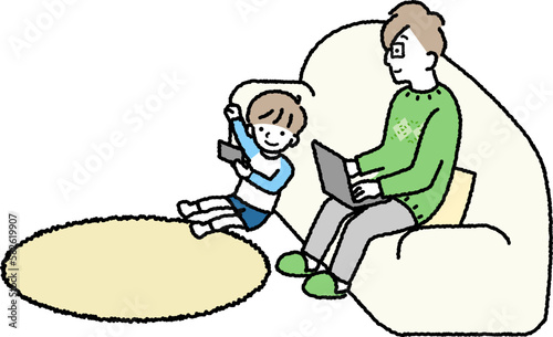 リビングで過ごす家族　ゲームする息子とパソコンを触っているお父さん