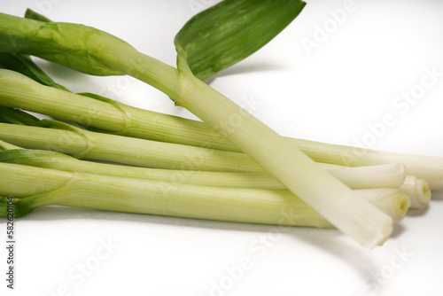 Green onions close-up on white background