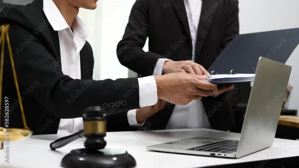 Male lawyer or judge consult having team meeting with client, Law and Legal services concept Male lawyer or judge consult having team meeting with client, Law and Legal services concept