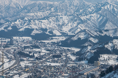 Town surrounded by snowy mountains on Winter season in Yuzawa , Niigata Prefecture, Japan