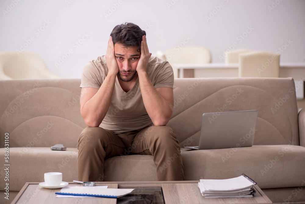 Young man working from home during pandemic Young man working from home during pandemic