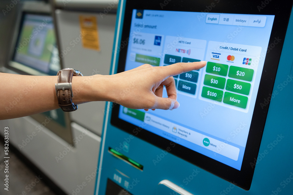 SINGAPORE APR 19, 2022 Lady's hand select the amount to be reload