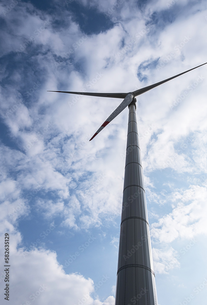 Wind generator turbine against blue cloudy sky. Wind generator turbine against blue cloudy sky.