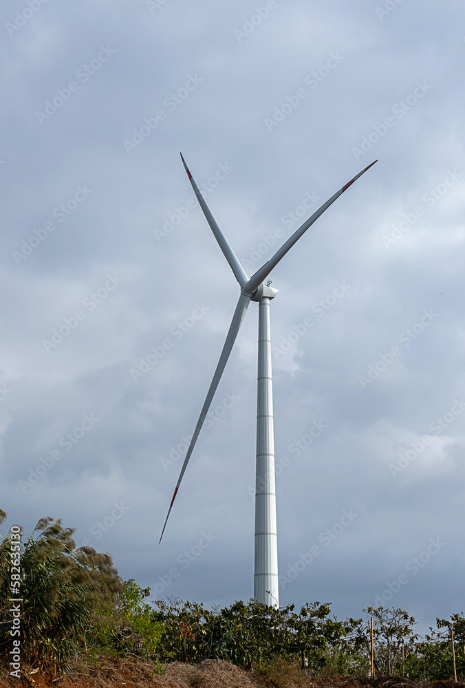 Wind generator turbine against blue cloudy sky. Wind generator turbine against blue cloudy sky.
