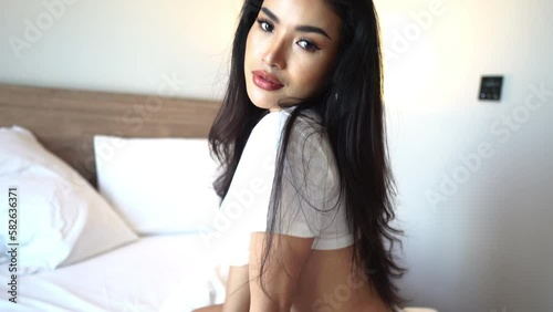 Beautiful Sexy Asian Female Model Posing to Camera in Bed