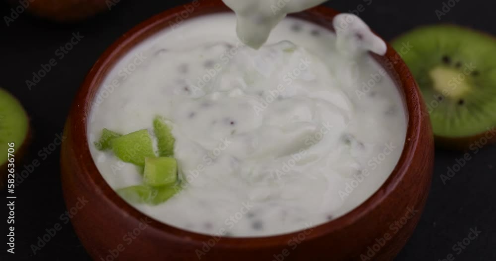 fresh yogurt made from natural ingredients with kiwi, milk fresh yogurt with kiwi flavor and kiwi slices fresh yogurt made from natural ingredients with kiwi, milk fresh yogurt with kiwi flavor and kiwi slices