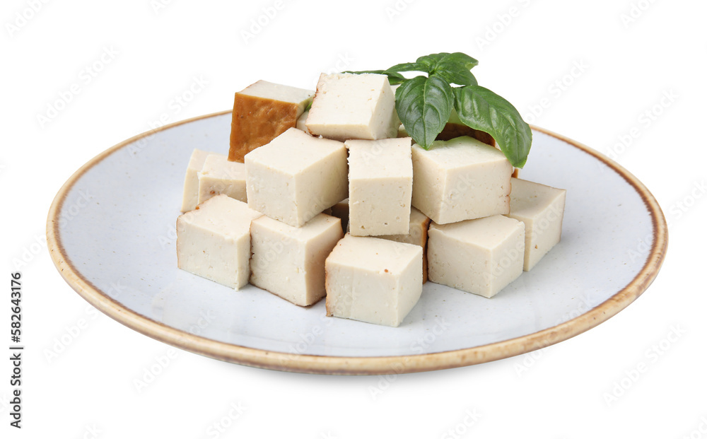 Plate with delicious fried tofu and basil on white background