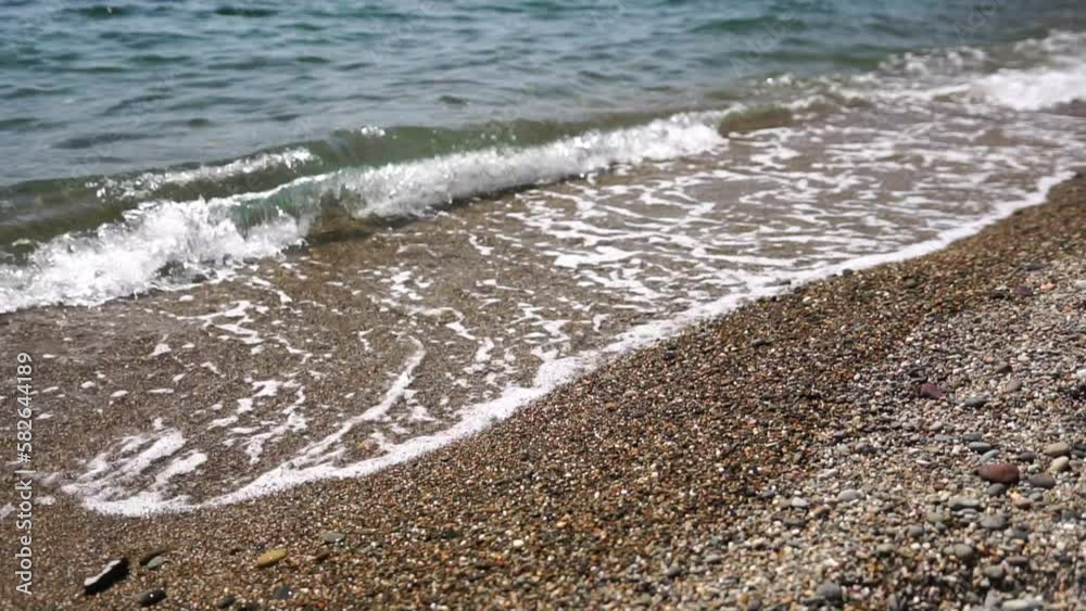 Small sea wave, Blurred Soft foamy waves washing golden sandy beach on sunset. Ocean Waves On Sandy Beach. Nobody. Holiday recreation concept. Abstract nautical summer ocean sunset nature background. Small sea wave, Blurred Soft foamy waves washing golden sandy beach on sunset. Ocean Waves On Sandy Beach. Nobody. Holiday recreation concept. Abstract nautical summer ocean sunset nature background.