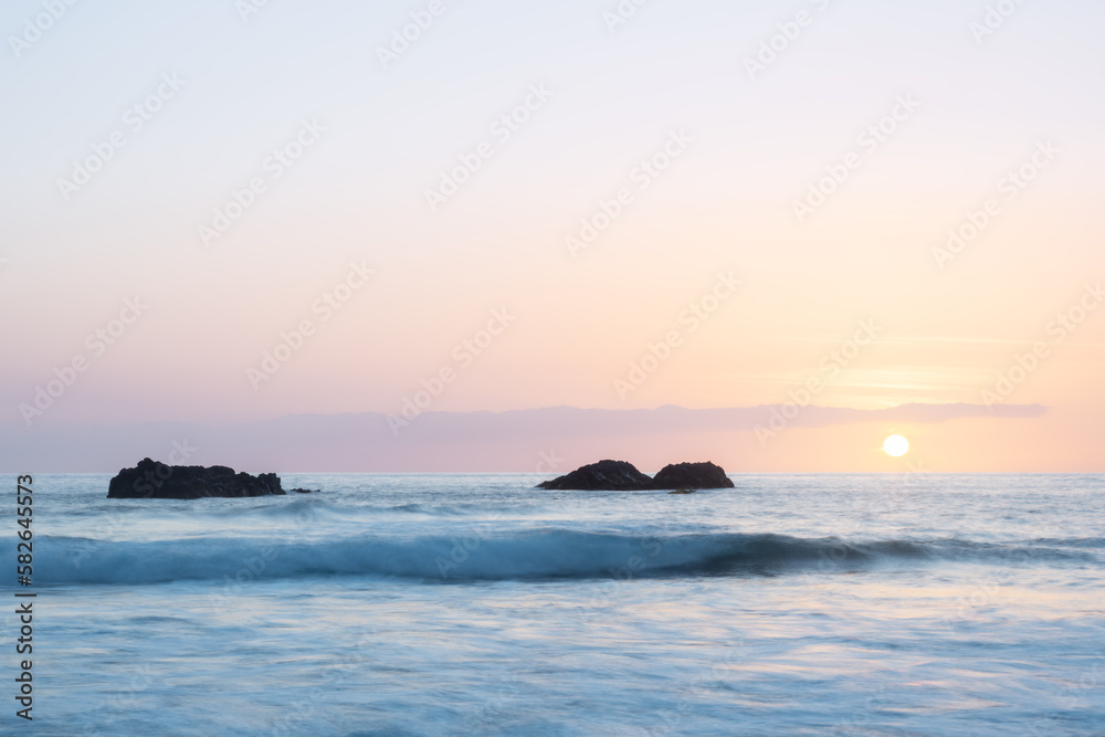sunset over the ocean with rocks. west coast of the island of La Palma, Spain sunset over the ocean with rocks. west coast of the island of La Palma, Spain
