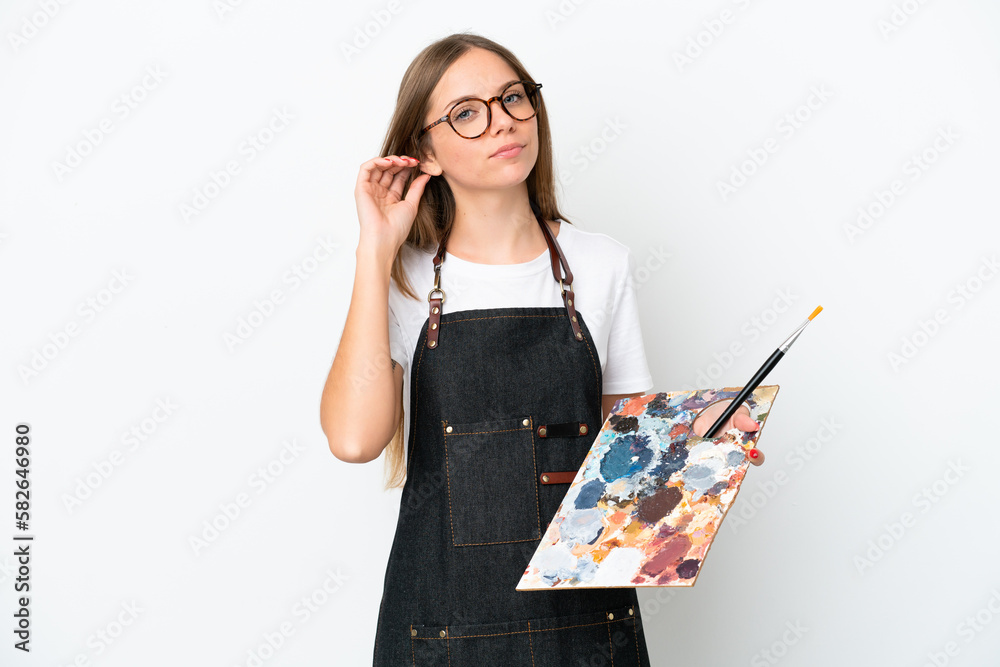 Young artist Lithuanian woman holding a palette isolated on white background having doubts Young artist Lithuanian woman holding a palette isolated on white background having doubts