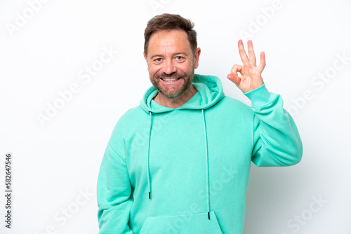 Middle age caucasian man isolated on white background showing ok sign with fingers © luismolinero