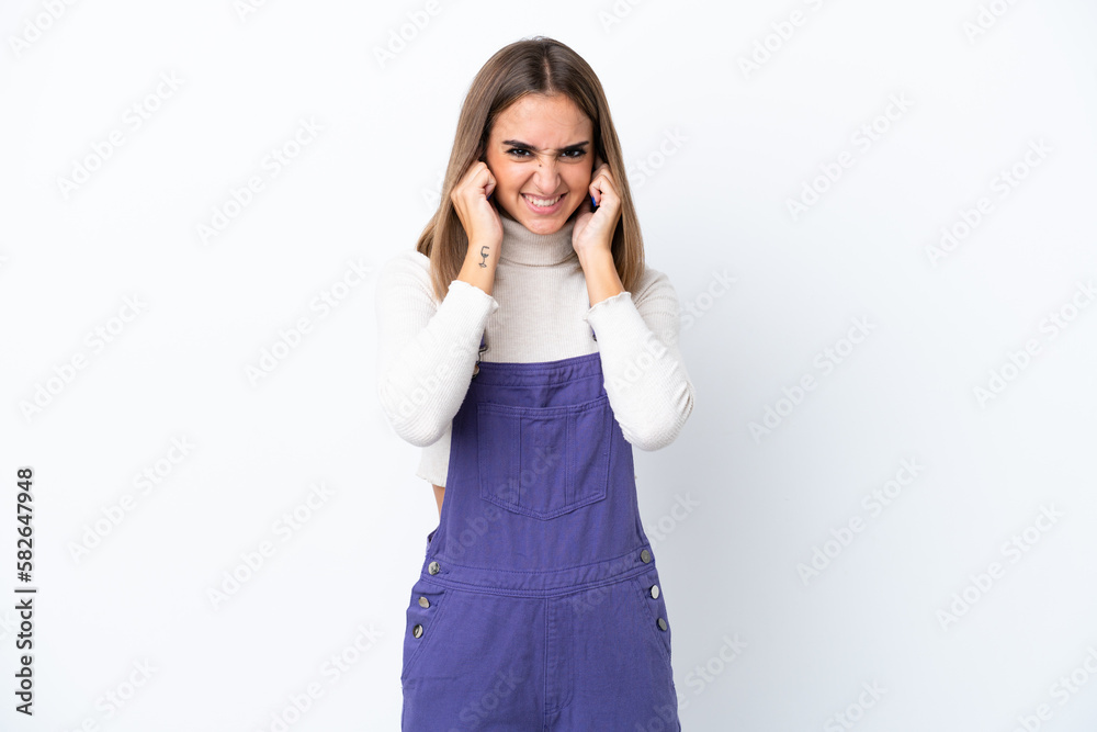 Young caucasian woman isolated on white background frustrated and covering ears Young caucasian woman isolated on white background frustrated and covering ears