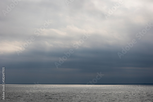black clouds and sea and light