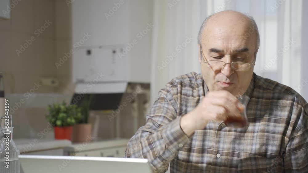 Thoughtful old man working on laptop.
Retired freelancer man working on laptop in kitchen.
Thoughtful old man working on laptop.
Retired freelancer man working on laptop in kitchen.