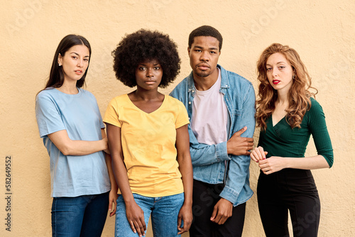 Fotografija Four multiethnic serious people looking at camera