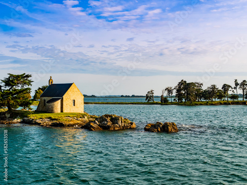 Stunning view of Boedic Island and its famous chapel at sunset, Morbihan Gulf, Brittany, France
 photo
