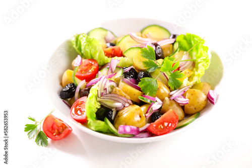 mixed vegetable salad with potato, tomato, olive and onion
