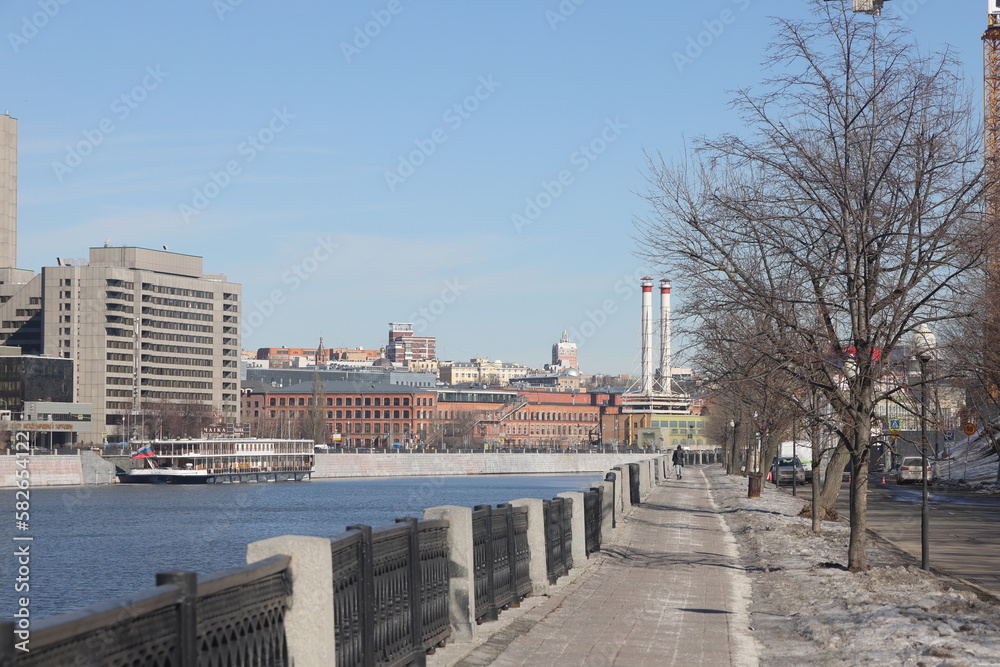 MOSCOW, RUSSIA - MARCH 18, 2023: Shevchenko Embankment on the Moskva River against the backdrop of the Moscow City buildings. MOSCOW, RUSSIA - MARCH 18, 2023: Shevchenko Embankment on the Moskva River against the backdrop of the Moscow City buildings.