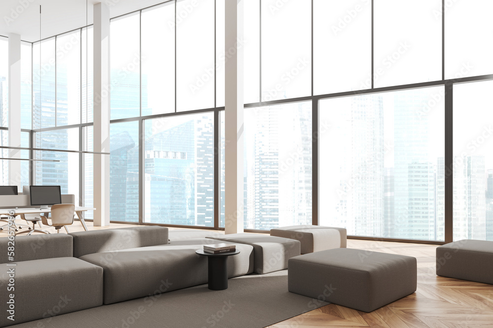 Fototapeta premium Cozy office interior with lounge zone with workplace near panoramic window