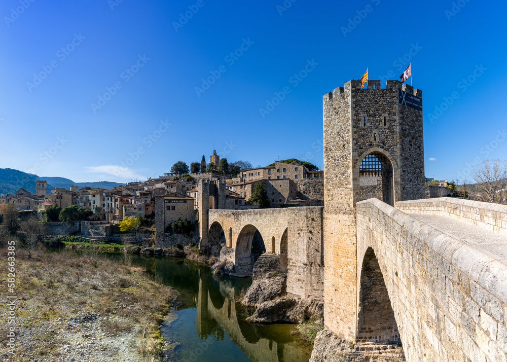 view of the medieval Romanesque bridge and village of Besalu in Catalonia