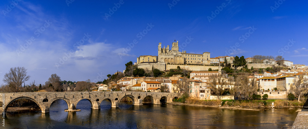panorama view of the historic old town center of Beziers with Saint Nazaire Church and Roman bridge over the river Orb