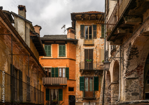 colorful shabby buildings in the old town center of Orta San Giulio