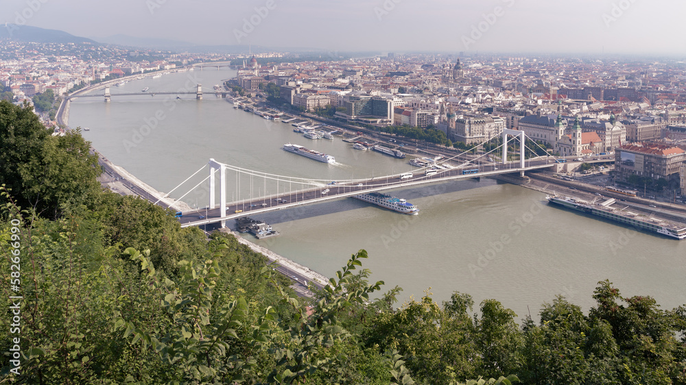 Cityscape panoramic view with Danube river bridges buildings and green forest, Budapest, Hungary