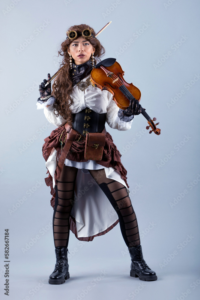 Country girl with viola on the grey background. Country girl with viola on the grey background.