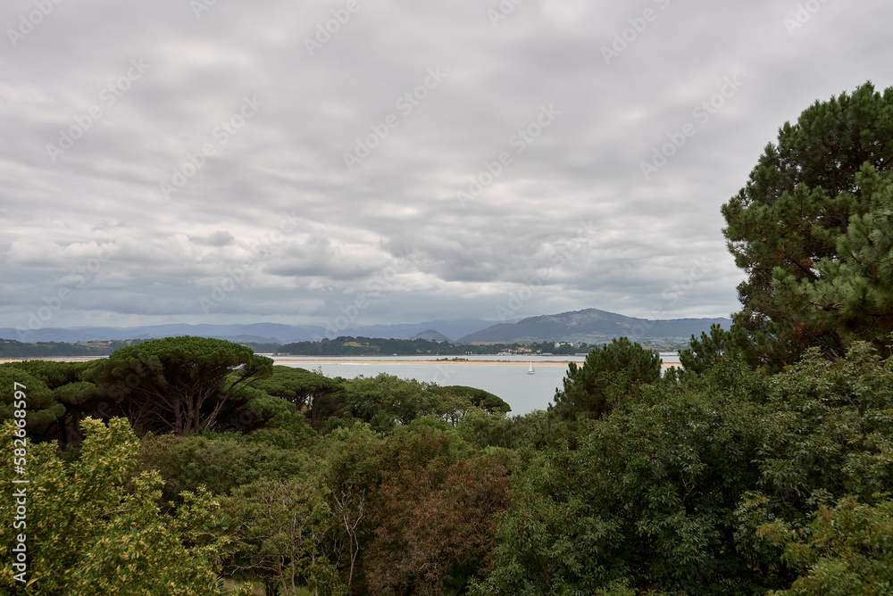 Santander Bay with boats on cloudy day