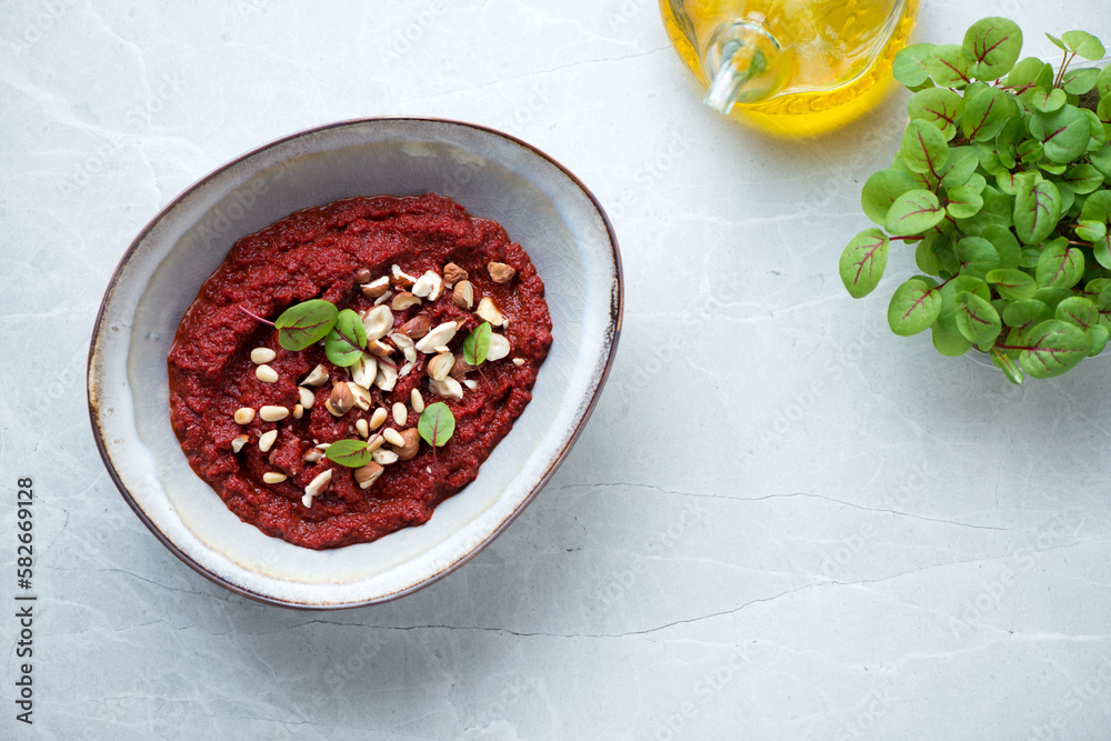 Bowl with caviar made of beetroot, top view on a grey granite background, horizontal shot with space Bowl with caviar made of beetroot, top view on a grey granite background, horizontal shot with space