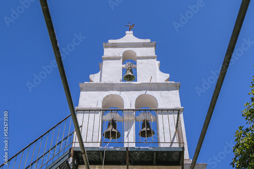 Bell tower on the entrance of St Euphemia Monastery in Corfu town on Corfu Island in Greece photo