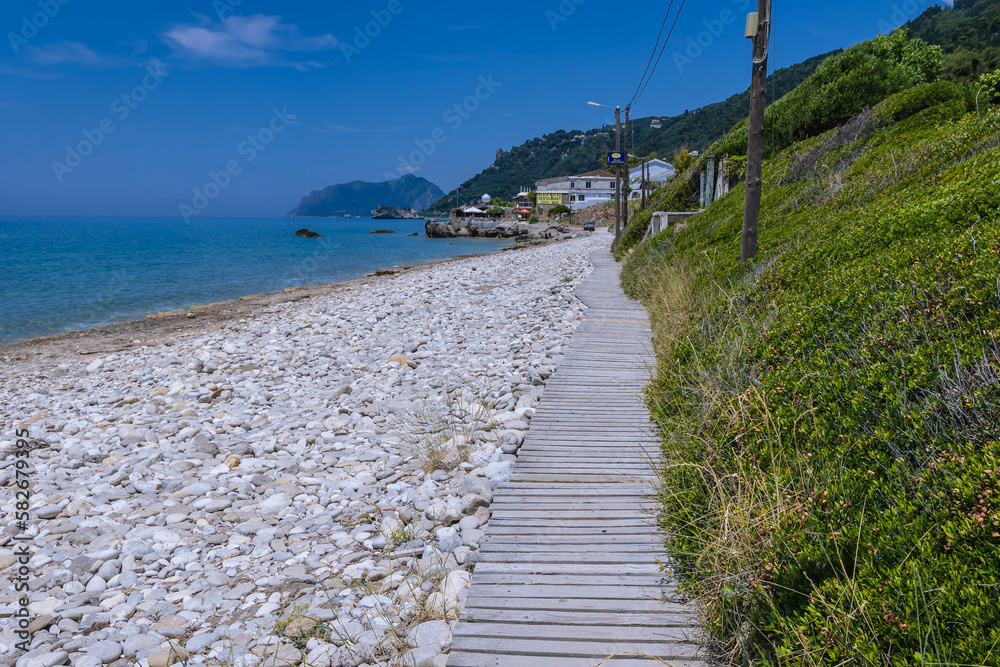 Beach in Agios Gordios village on the Ionian Sea coast, Corfu Island, Greece