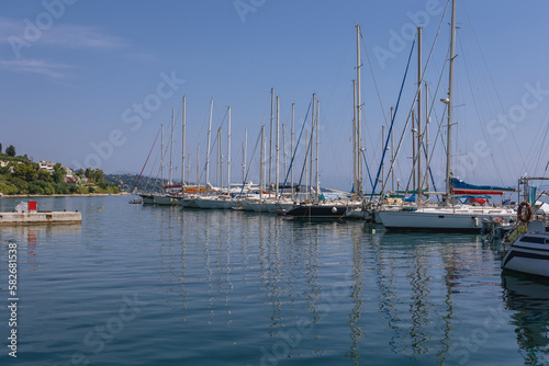 Yachts in marina of Benitses town on the Ionian Sea shore on Corfu Island, Greece