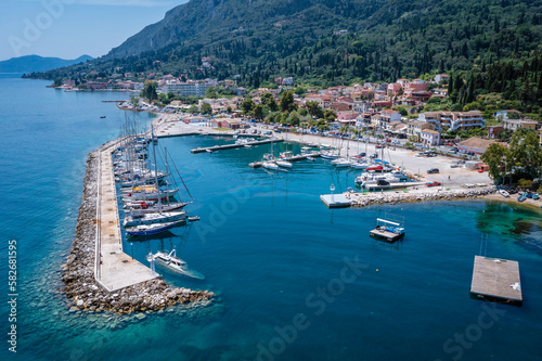 Marina in Benitses village on the Ionian Sea shore in Corfu Island, Greece photo